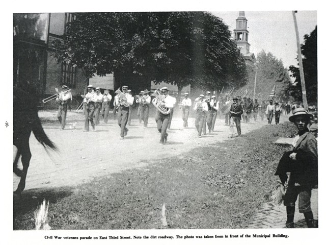 Civil War Veterans parade on East Third Stree. Note the dirt roadway. The photo was taken from in front of the Municipal Building.