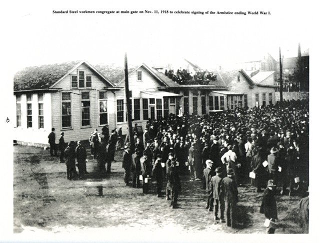 Standard Steel workmen congregate at main gate on Nov. 11, 1918 to celebrate signing of the Armistice ending World War I.