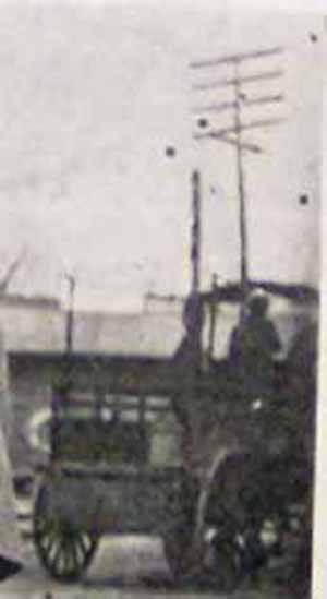 Close-up of Old Truck near Shoe Stand in Street in McDonald PA Washington Co PA Unknown Date